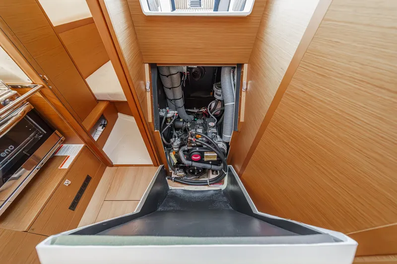 Slide: The Image of Engine compartment of 2022 Jeanneau Sun Odyssey 349 sailboat, showcasing interior design and mechanics. - 23