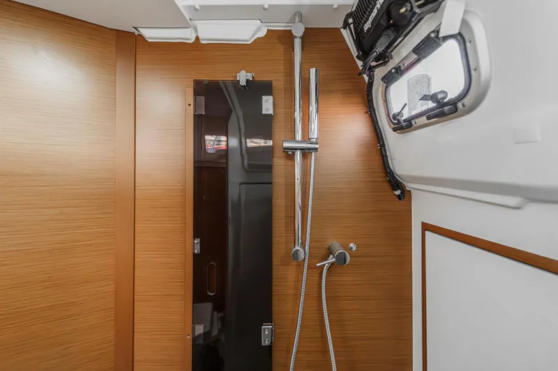 Slide: The Image of Modern bathroom interior of 2022 Jeanneau Sun Odyssey 349 yacht, featuring sleek shower design. - 26