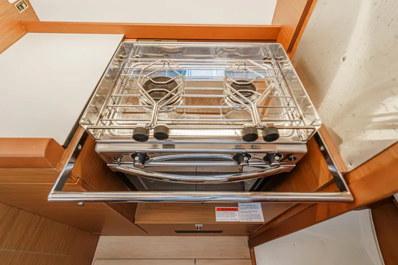 Slide: The Image of Compact kitchen stove in 2022 Jeanneau Sun Odyssey 349 sailboat galley. - 34