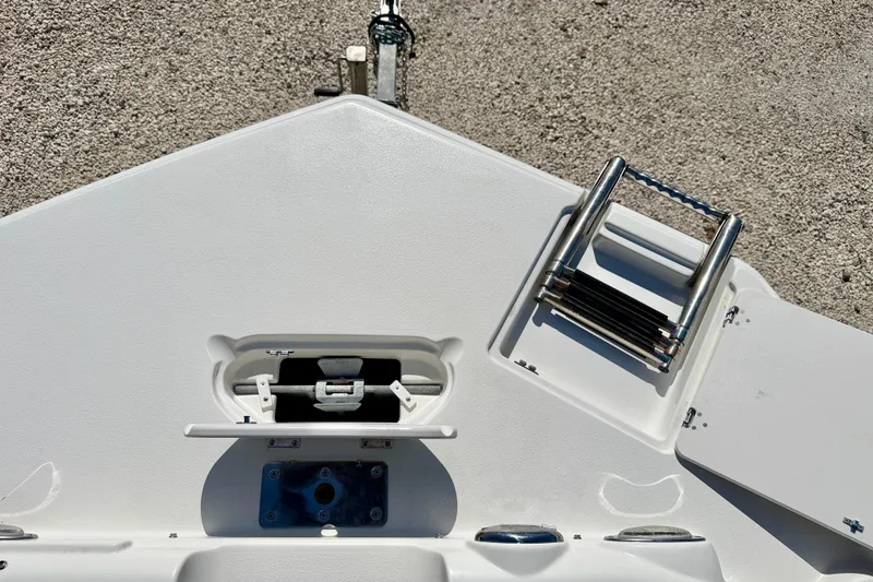 Slide: The Image of Bow view of 2014 NauticStar 243DC Sport Deck with anchor storage and ladder. - 30