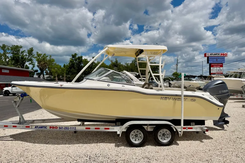 The Image of 2024 Key West 239 DFS boat on trailer under cloudy sky. - 0