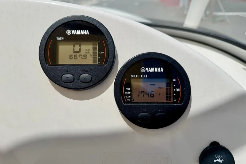 Slide: The Image of Yamaha gauges on 2024 Key West 239 DFS boat dashboard, displaying tachometer and speed fuel readings. - 16