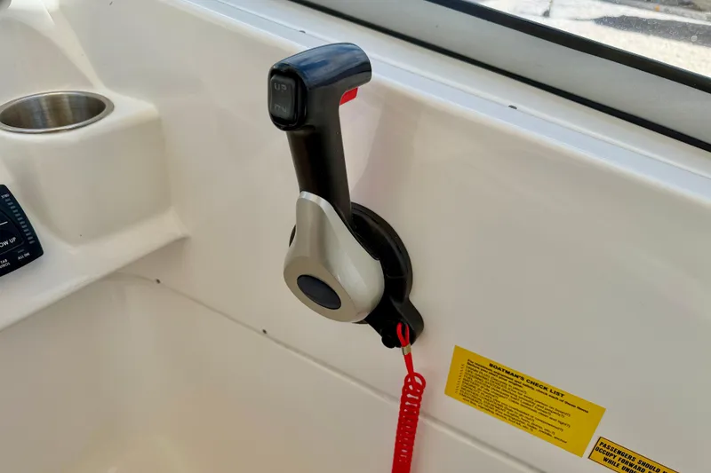 Slide: The Image of Throttle control lever on 2024 Key West 239 DFS boat dashboard. - 17