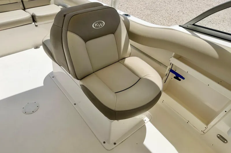 Slide: The Image of 2024 Key West 239 DFS boat seat, featuring beige and gray upholstery. - 20