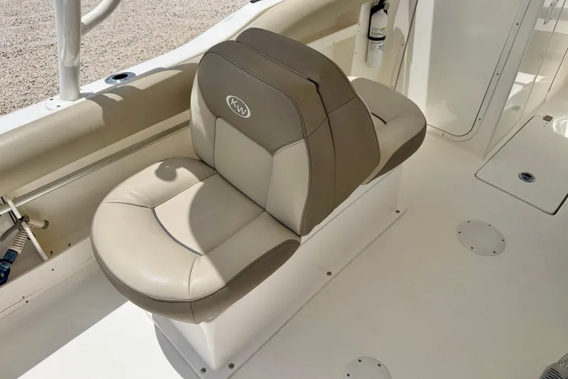 Slide: The Image of 2024 Key West 239 DFS boat seat, beige and brown upholstery, with KW logo. - 21