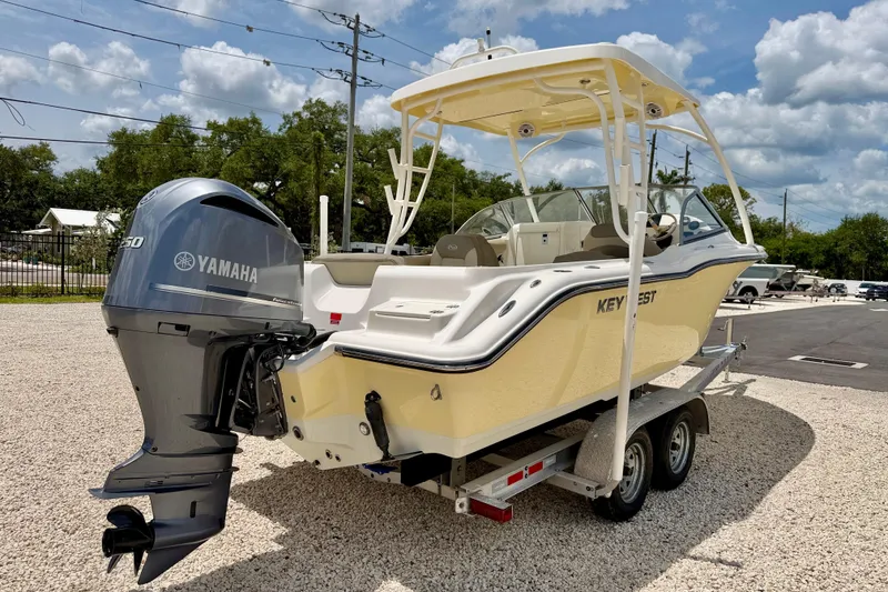 Slide: The Image of 2024 Key West 239 DFS boat with Yamaha engine on trailer, parked outdoors. - 5