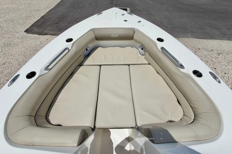 Slide: The Image of 2024 Key West 239 DFS boat with beige cushioned seating area. - 9