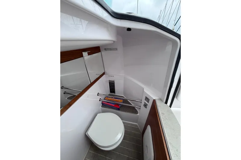 Slide: The Image of 2022 Axopar 28 Cabin bathroom with modern fixtures and sleek design. - 23