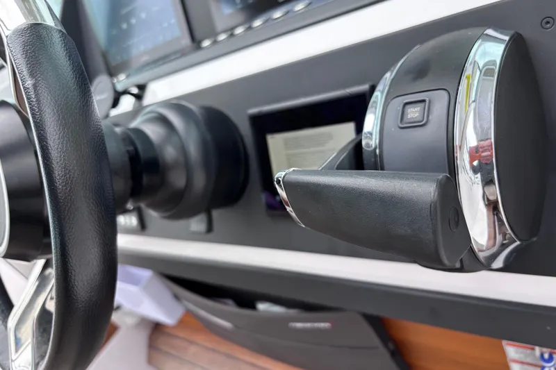 Slide: The Image of 2022 Axopar 28 Cabin interior bathroom with modern fixtures and sleek design. - 24