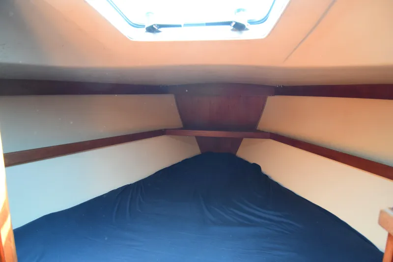 Slide: The Image of Interior cabin of 1989 Catalina 36 sailboat with cozy sleeping area and overhead hatch. - 11