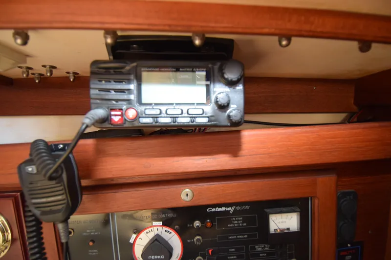 Slide: The Image of VHF radio and control panel inside a 1989 Catalina 36 yacht cabin. - 28