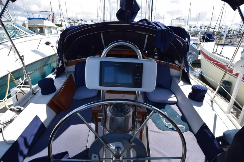 Slide: The Image of Cockpit of a 1989 Catalina 36 sailboat with navigation equipment and seating. - 3