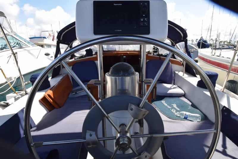 Slide: The Image of Cockpit of 1989 Catalina 36 sailboat with steering wheel and navigation equipment. - 31
