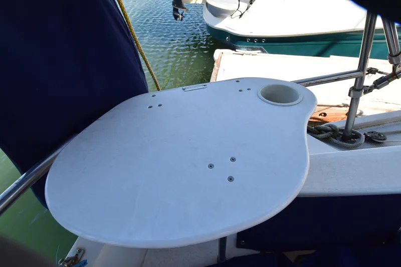Slide: The Image of Cockpit table on a 1989 Catalina 36 sailboat, featuring a cup holder. - 33