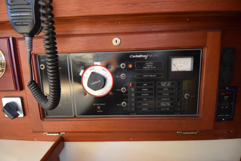 Slide: The Image of Control panel of a 1989 Catalina 36 sailboat with radio and switches. - 7