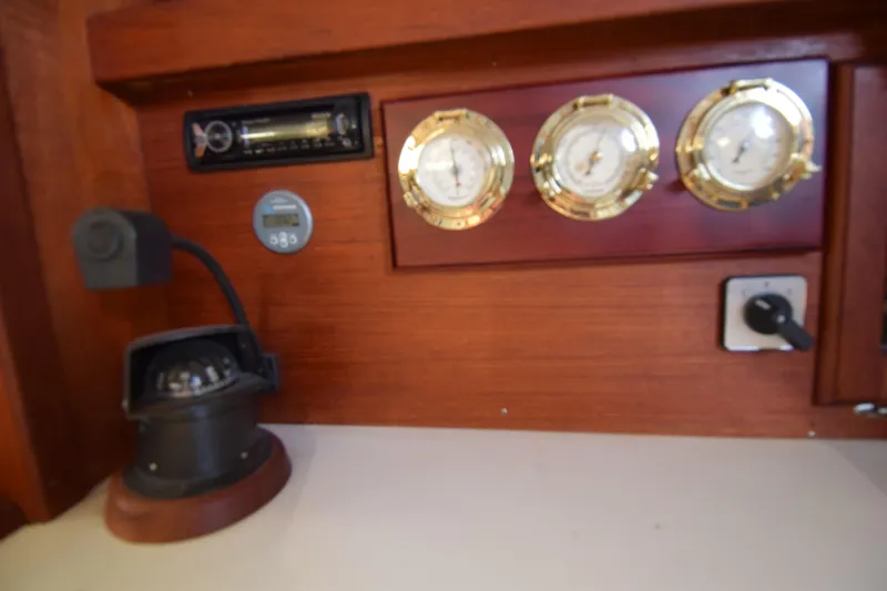 Slide: The Image of 1989 Catalina 36 yacht interior with compass, gauges, and control panel. - 8