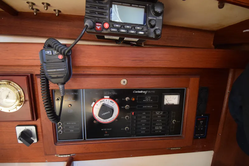 Slide: The Image of Control panel of a 1989 Catalina 36 yacht with radio and gauges. - 9