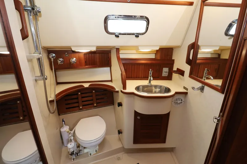 Slide: The Image of Luxurious 2001 Island Packet 380 yacht bathroom with wooden accents and modern fixtures. - 15