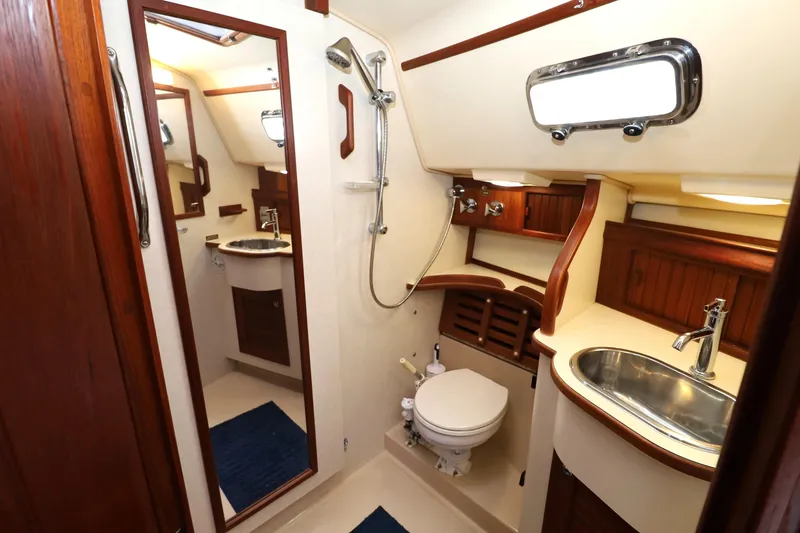 Slide: The Image of Luxurious bathroom interior of 2001 Island Packet 380 yacht, featuring wood accents and modern fixtures. - 16