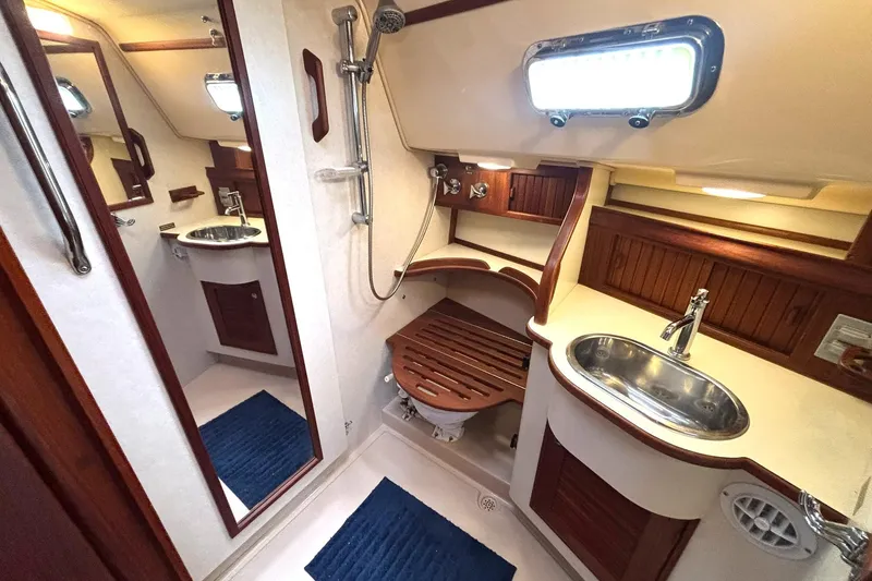 Slide: The Image of Luxurious bathroom in 2001 Island Packet 380 yacht with wooden accents and modern fixtures. - 17