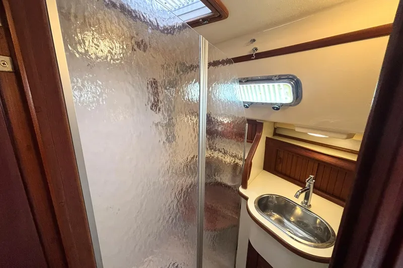 Slide: The Image of Bathroom interior of 2001 Island Packet 380 yacht with shower and sink. - 18
