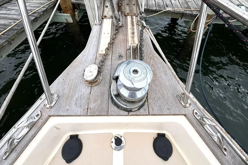 Slide: The Image of Bow of 2001 Island Packet 380 sailboat with anchor chain and winch. - 31