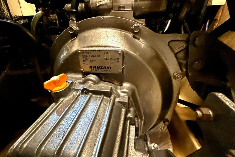 Slide: The Image of Engine compartment of a 2001 Island Packet 380 sailboat, featuring a Kanzaki gearbox. - 40