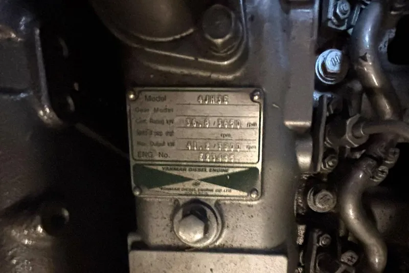 Slide: The Image of Engine plate of a 2001 Island Packet 380 sailboat, displaying technical specifications. - 41