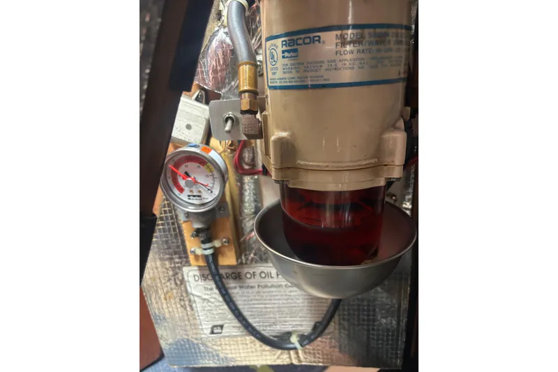 Slide: The Image of Fuel filter system on a 2001 Island Packet 380 sailboat, featuring a Racor filter. - 42