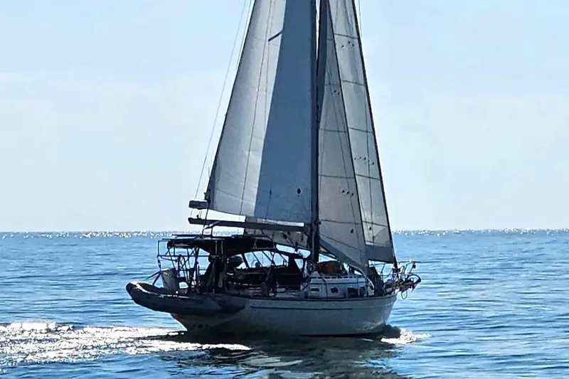 Slide: The Image of Sailing yacht Island Packet 380, 2001 model, gliding on calm ocean waters. - 45