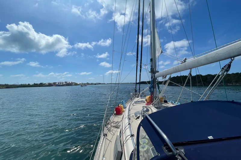 Slide: The Image of Sailing on a 2001 Island Packet 380 yacht under a clear blue sky. - 48