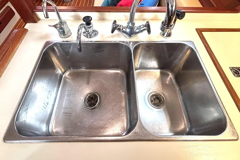 Slide: The Image of Stainless steel double sink in 2001 Island Packet 380 yacht galley. - 8