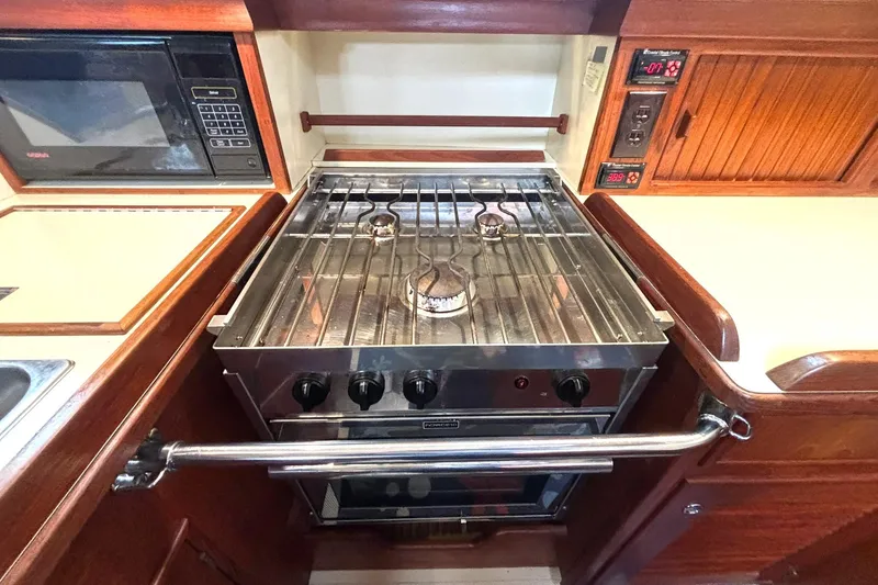 Slide: The Image of Galley kitchen in 2001 Island Packet 380 yacht with stove and microwave. - 9