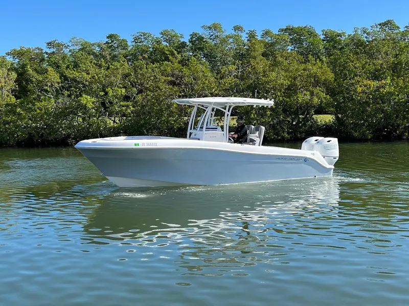 The Image of 2022 Aquasport 2500 Center Console on calm water. - 0