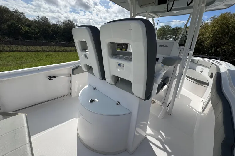Slide: The Image of 2022 Aquasport 2500 Center Console boat interior with seating and console features. - 23