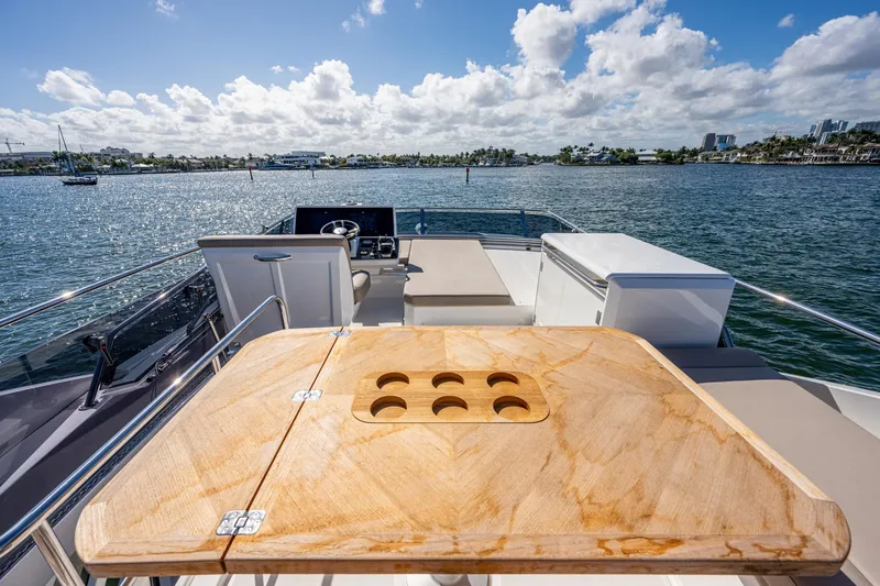 Slide: The Image of Greenline 45 Fly 2022 yacht with wooden table and sea view. - 34