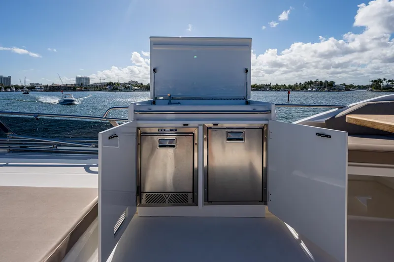 Slide: The Image of Greenline 45 Fly 2022 yacht with outdoor kitchen by the water. - 39