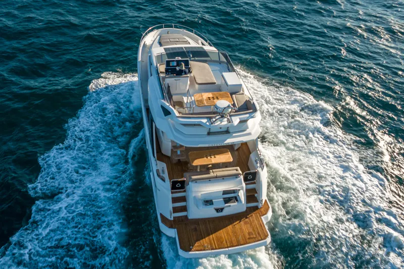 Slide: The Image of Aerial view of 2022 Greenline 45 Fly yacht cruising on the sea. - 4