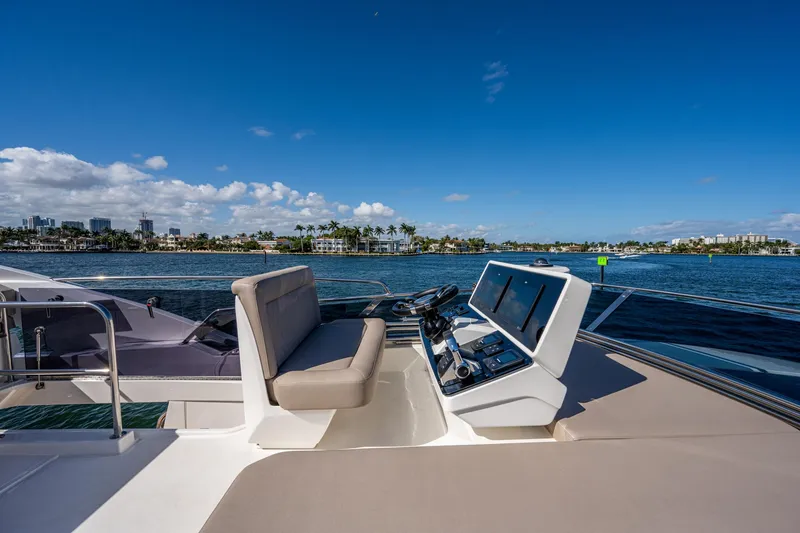 Slide: The Image of Greenline 45 Fly 2022 on open water with blue sky. - 44