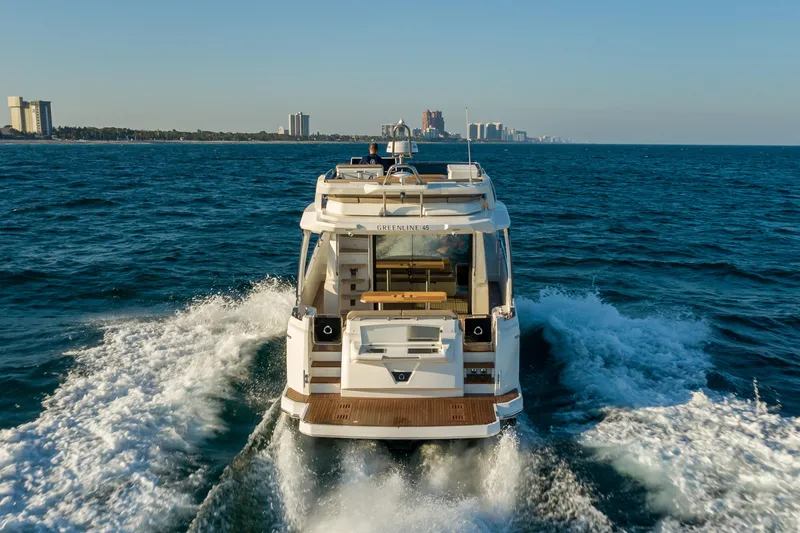 Slide: The Image of Greenline 45 Fly 2022 yacht cruising on open sea, rear view. - 7