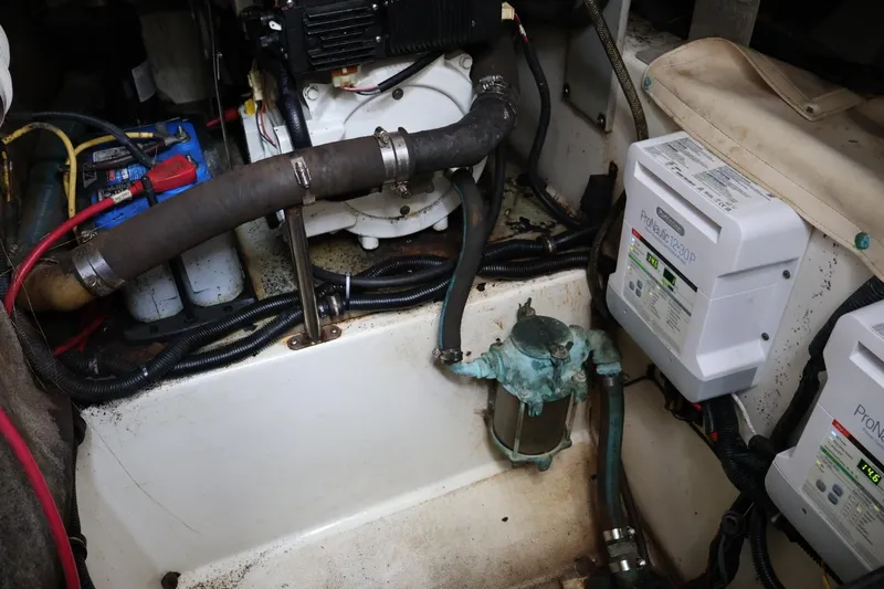 Slide: The Image of Engine compartment of a 2006 Hydra-Sports Vector 3300 VX with wiring and components visible. - 12