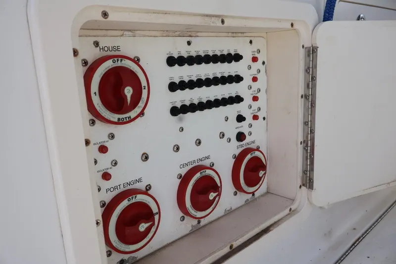 Slide: The Image of Control panel of a 2006 Hydra-Sports Vector 3300 VX boat, featuring engine switches. - 5