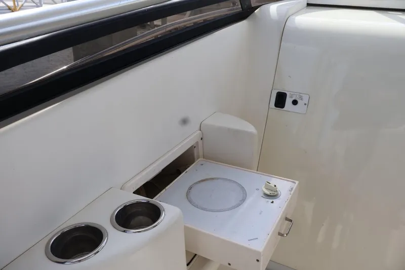 Slide: The Image of 2006 Hydra-Sports Vector 3300 VX interior with built-in cup holders and stove. - 7