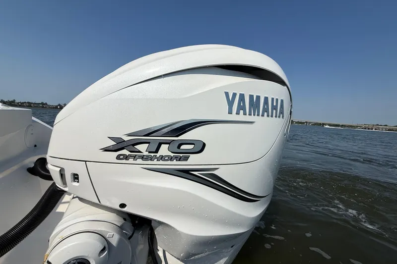 Slide: The Image of Yamaha XTO Offshore engine on 2023 Cobia 350 Center Console boat in water. - 10