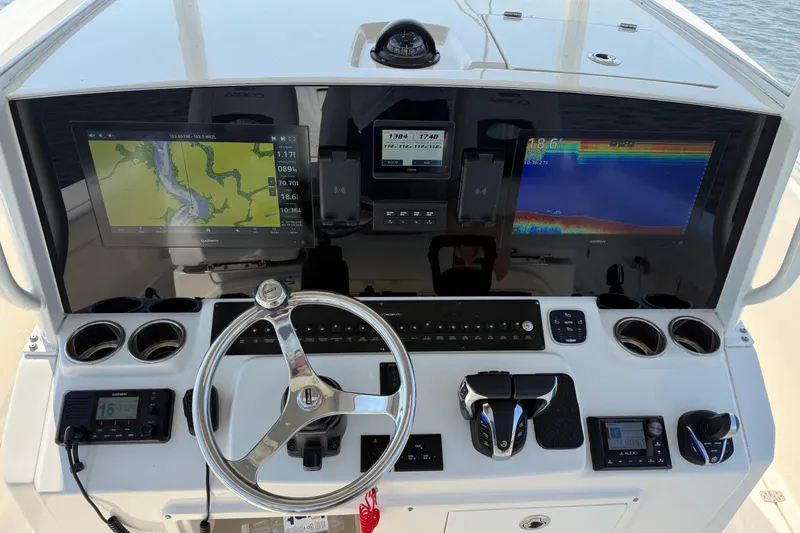 Slide: The Image of 2023 Cobia 350 Center Console dashboard with advanced navigation and control systems. - 11