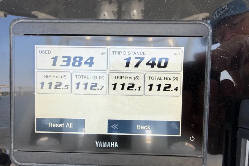 Slide: The Image of Yamaha display showing fuel usage and trip data on 2023 Cobia 350 Center Console. - 14