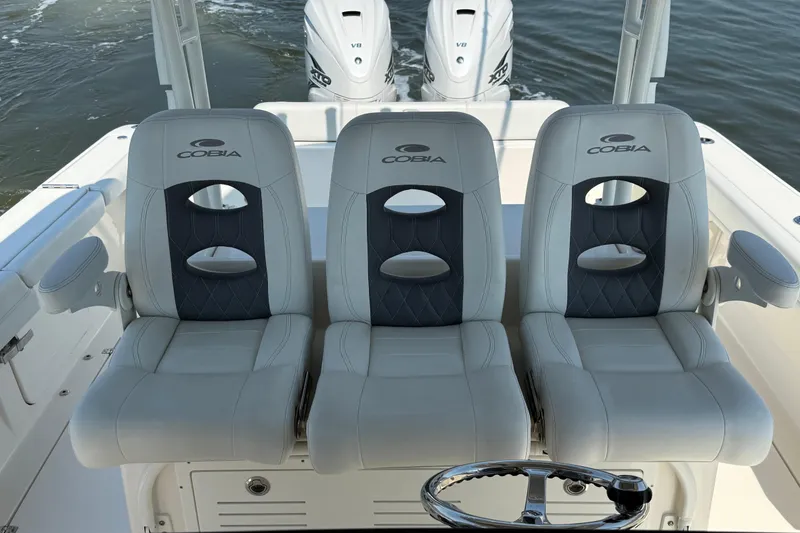 Slide: The Image of 2023 Cobia 350 Center Console boat seats with dual engines in the background. - 21