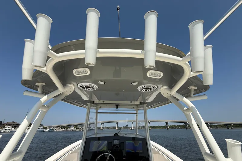 Slide: The Image of 2023 Cobia 350 Center Console boat with rod holders and electronics, viewed from below. - 33