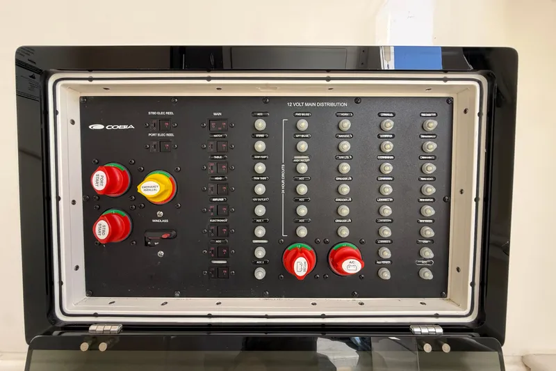 Slide: The Image of Control panel of 2023 Cobia 350 Center Console boat with switches and emergency controls. - 44