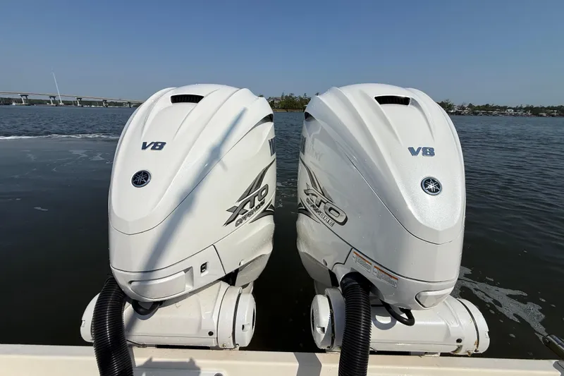 Slide: The Image of Twin Yamaha V8 outboard engines on a 2023 Cobia 350 Center Console boat. - 8